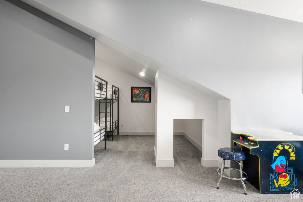 Bonus room featuring carpet and baseboards
