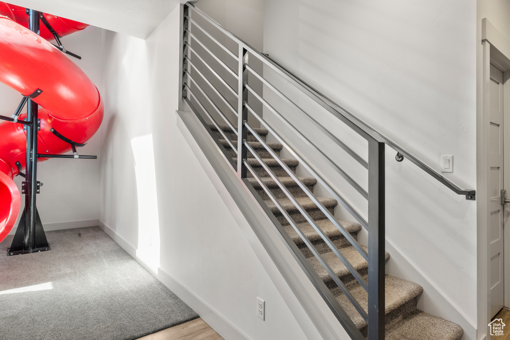 Stairway featuring baseboards