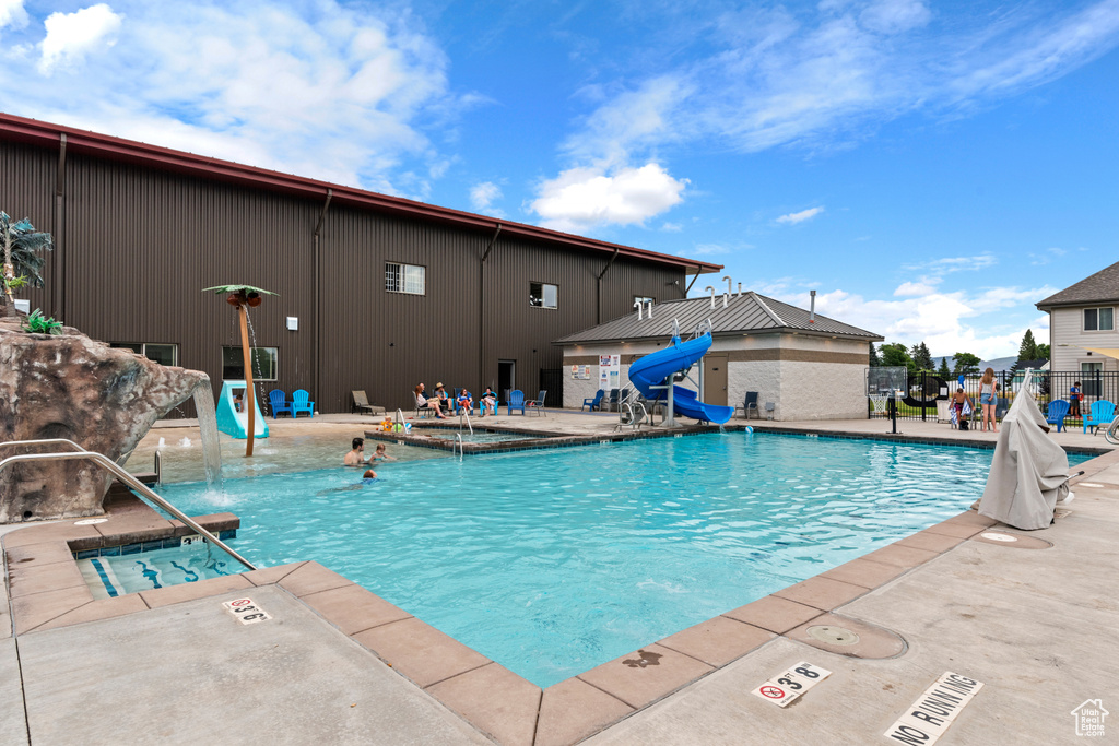 Community pool with a patio