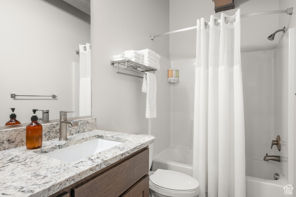 Full bath with shower / tub combo and vanity