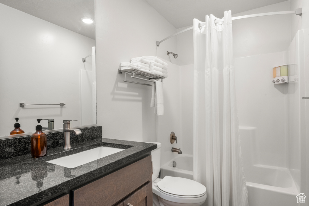 Full bathroom with shower / bath combo and vanity