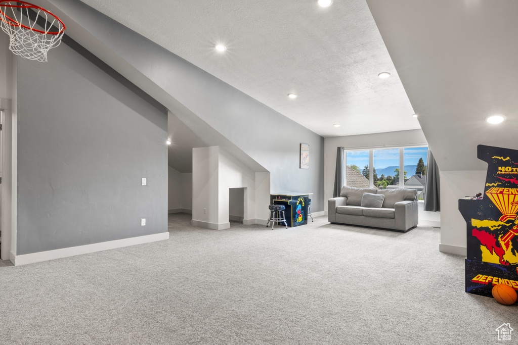 Playroom with carpet floors and recessed lighting