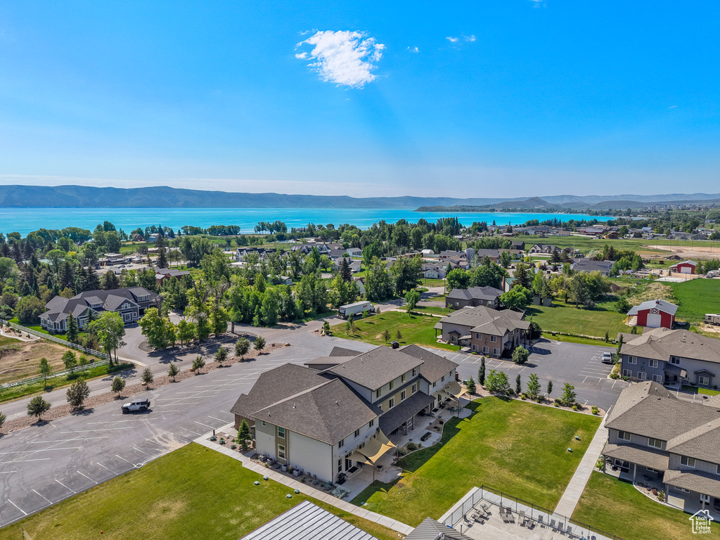Aerial view of residential area featuring a water and mountain view