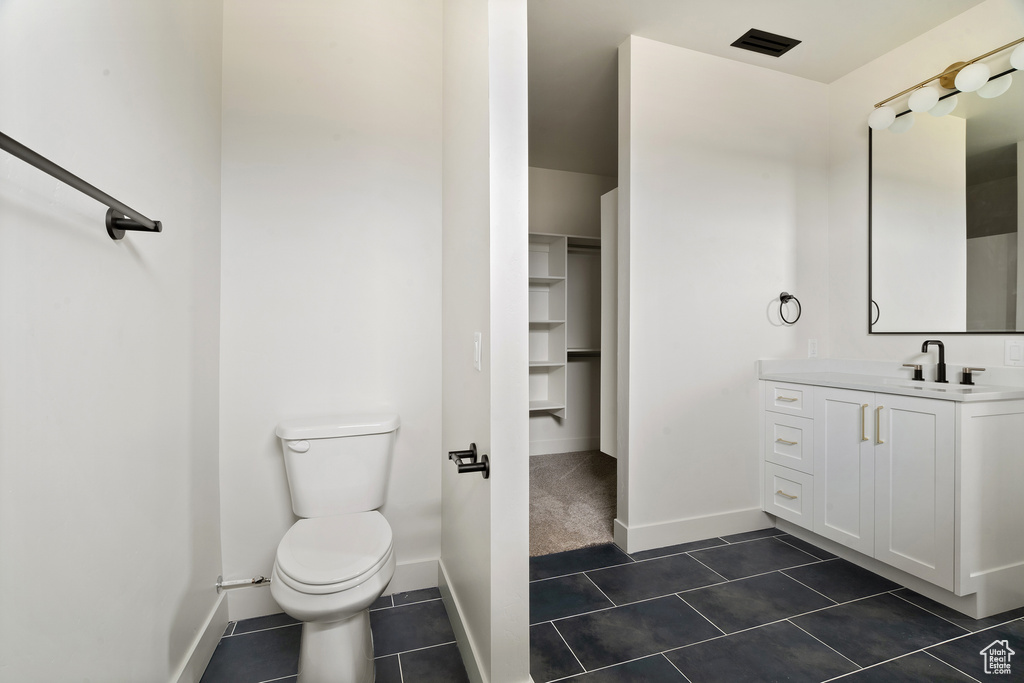 Bathroom featuring vanity and tile patterned flooring