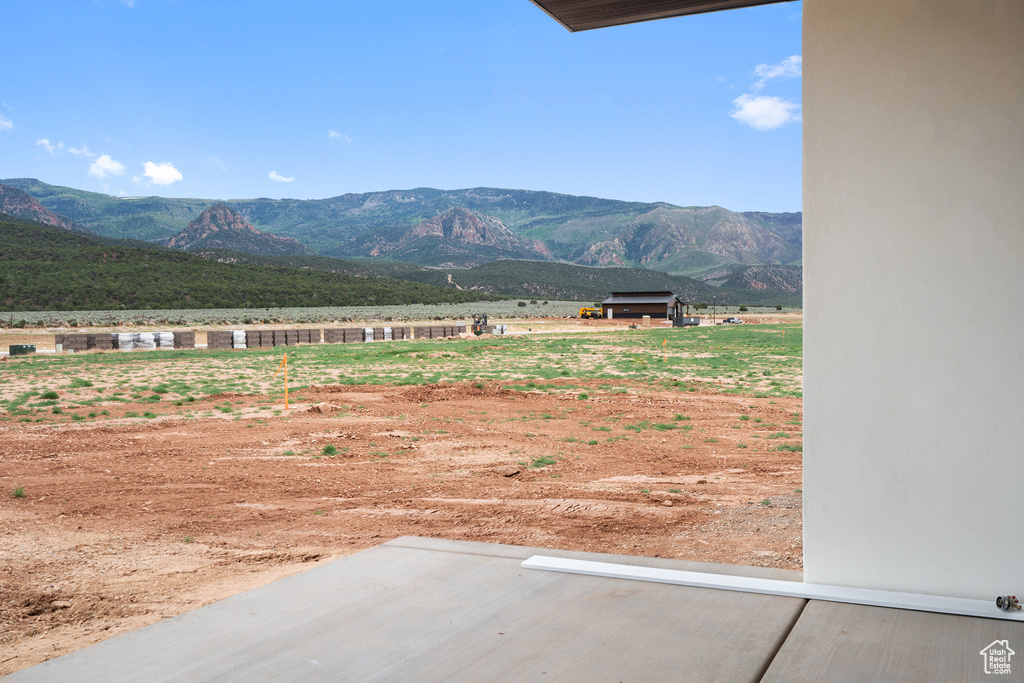 View of mountain backdrop featuring rural landscape