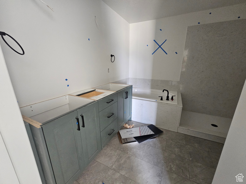 Bathroom with a bath and vanity