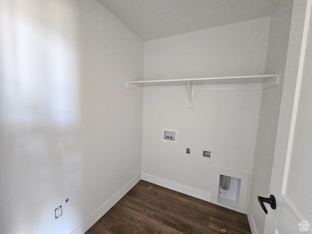 Laundry room with hookup for a washing machine and dark wood finished floors