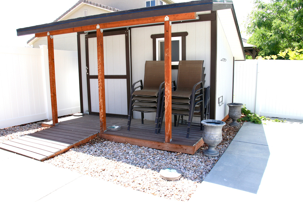 View of outdoor structure featuring a fenced backyard