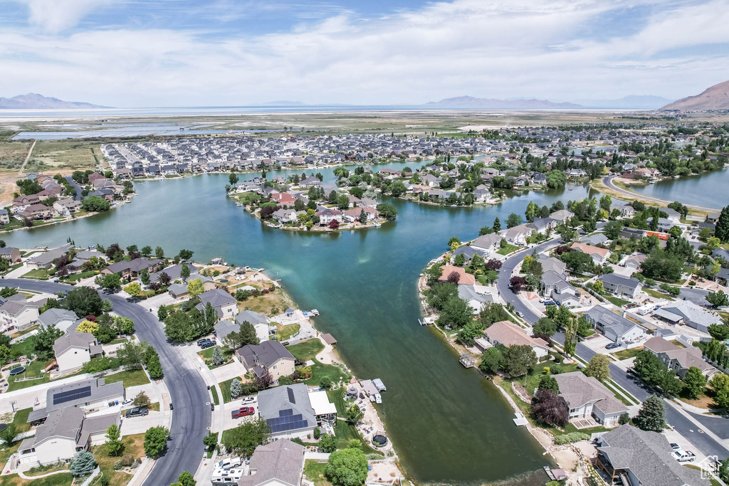 View of property location featuring nearby suburban area and a water and mountain view