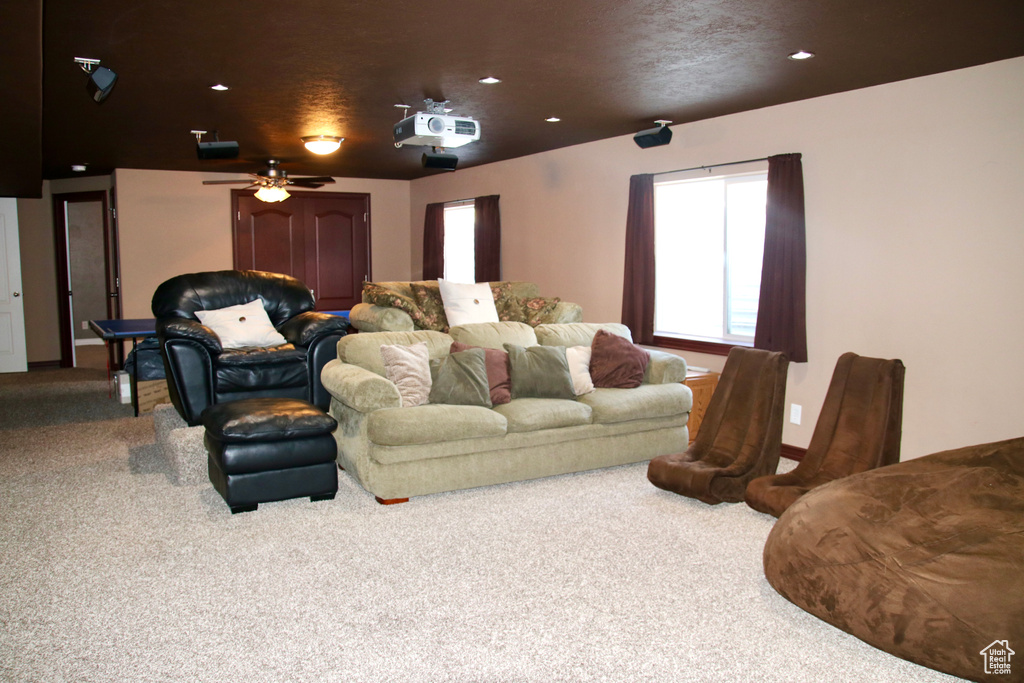 Home theater room with carpet, plenty of natural light, ceiling fan, and recessed lighting
