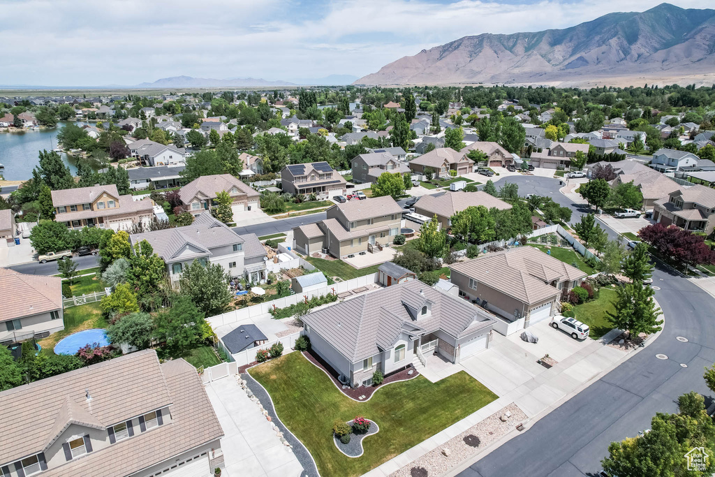 Aerial view of residential area featuring a mountain backdrop