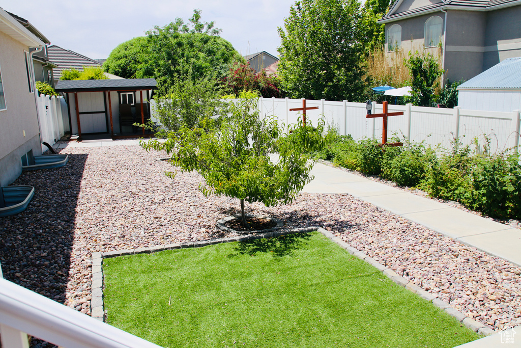 Fenced backyard with a shed