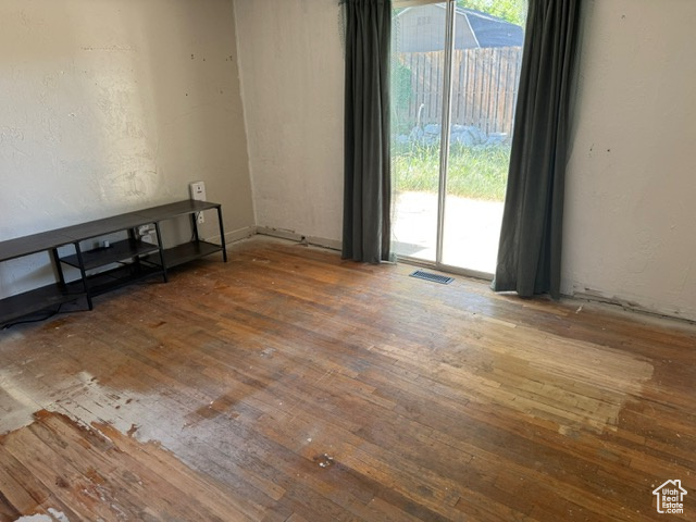Unfurnished room with hardwood / wood-style flooring