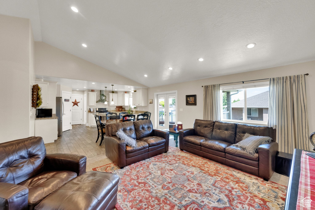 Living area featuring recessed lighting and lofted ceiling