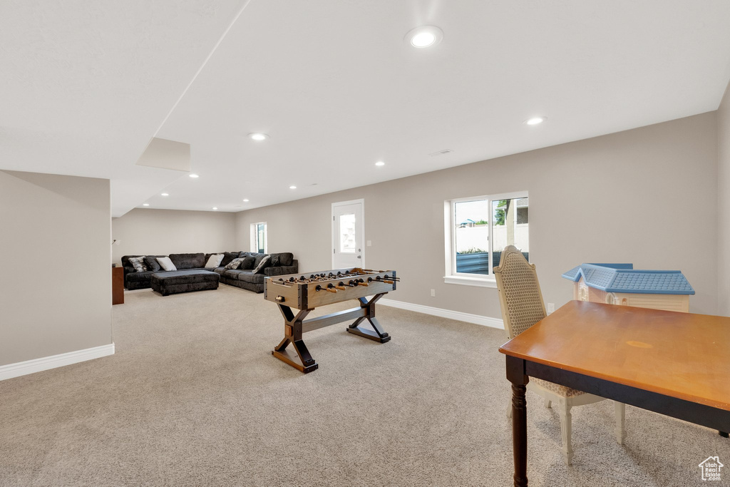 Recreation room with carpet and recessed lighting