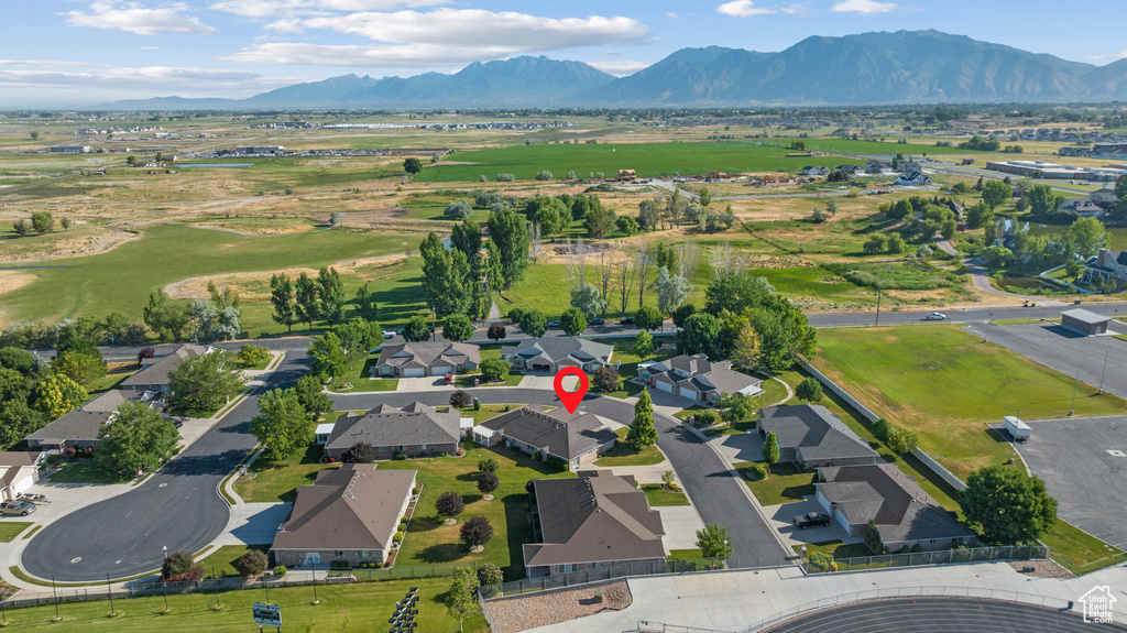 View of property location featuring a mountainous background and nearby suburban area