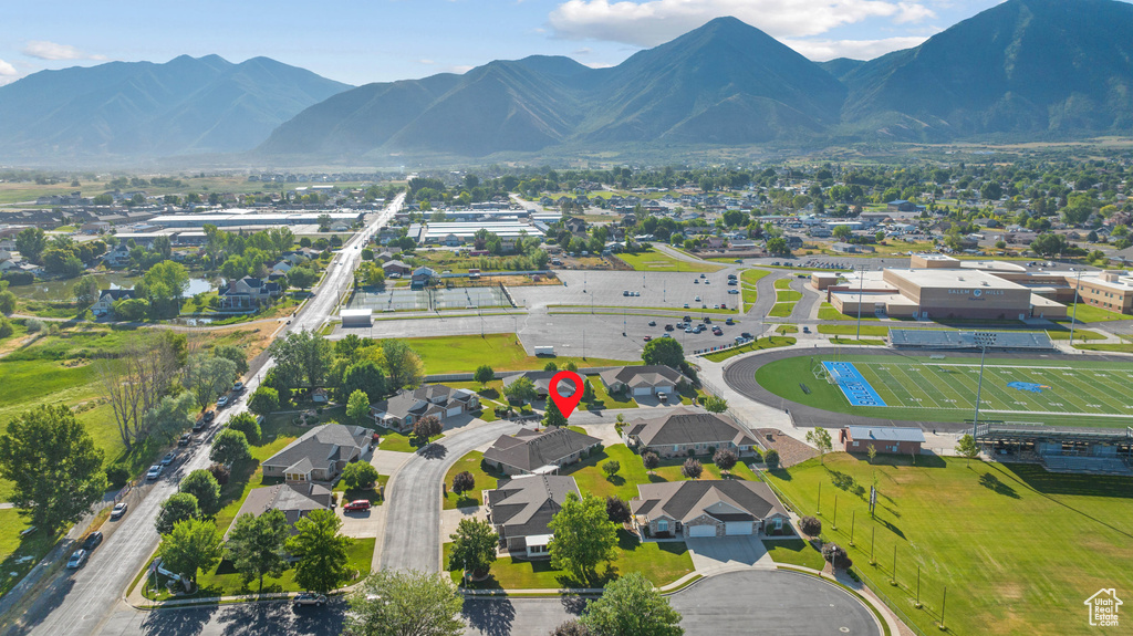 View of property location with a mountain backdrop and nearby suburban area