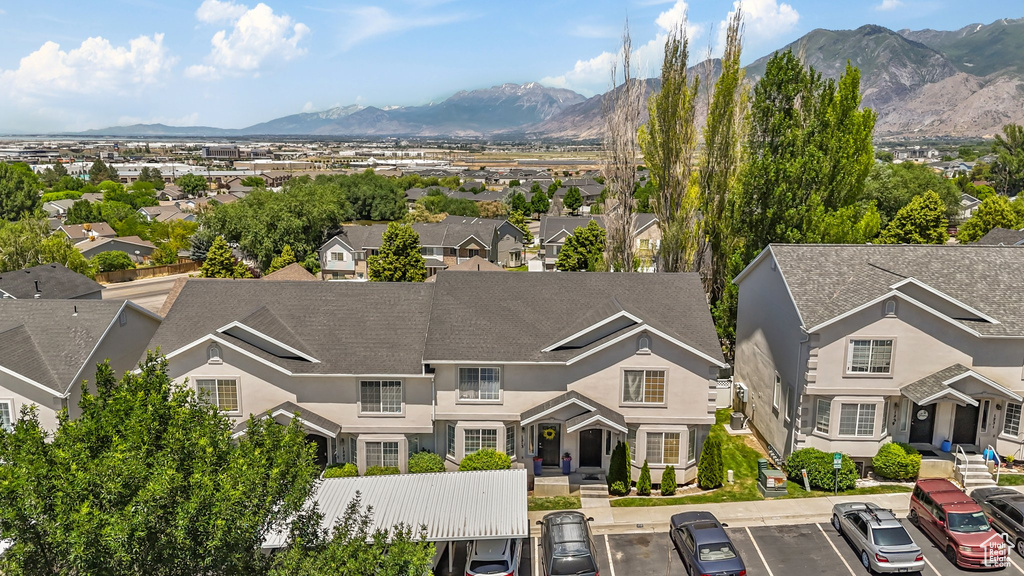 Aerial view of residential area featuring a mountainous background