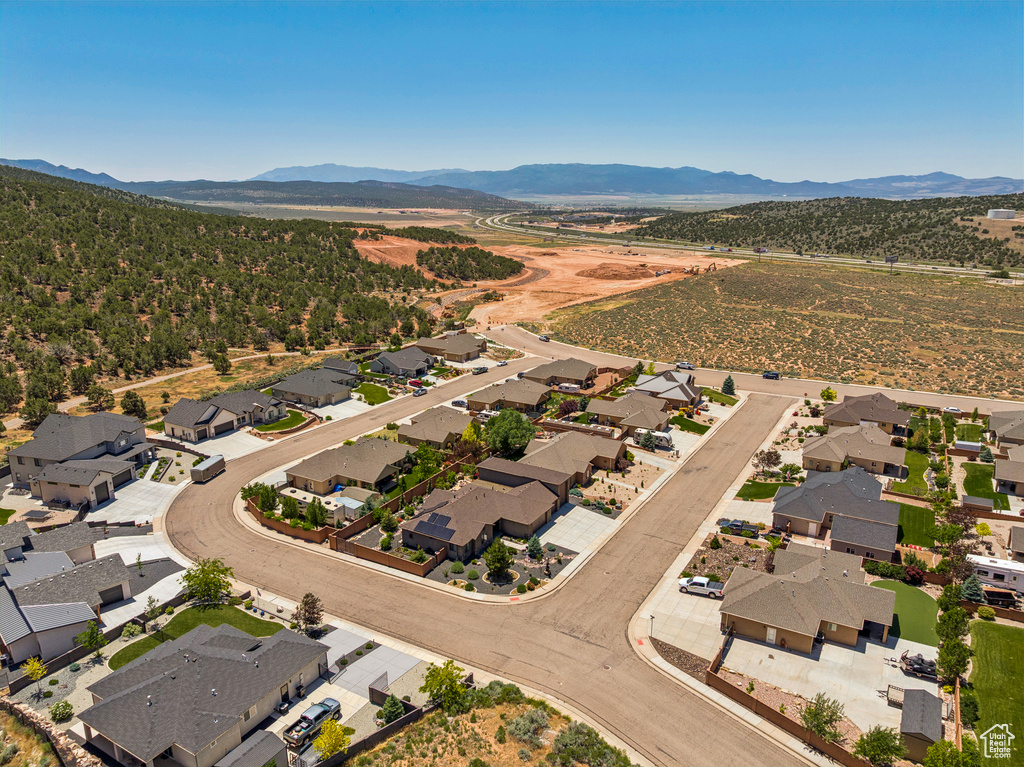 Aerial view of residential area featuring mountains