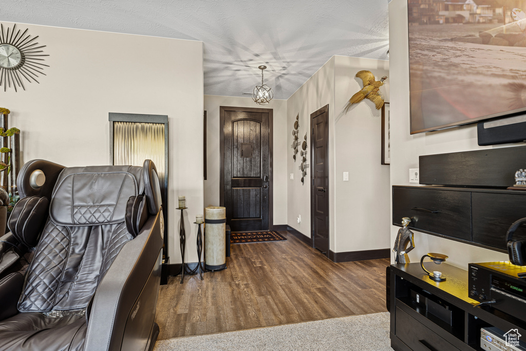 Entryway featuring baseboards and dark wood-type flooring