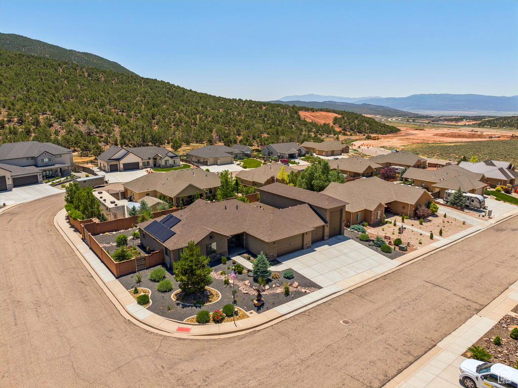 Aerial perspective of suburban area with a mountain backdrop