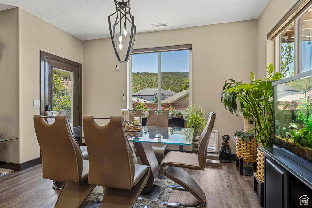 Dining area with wood finished floors and baseboards