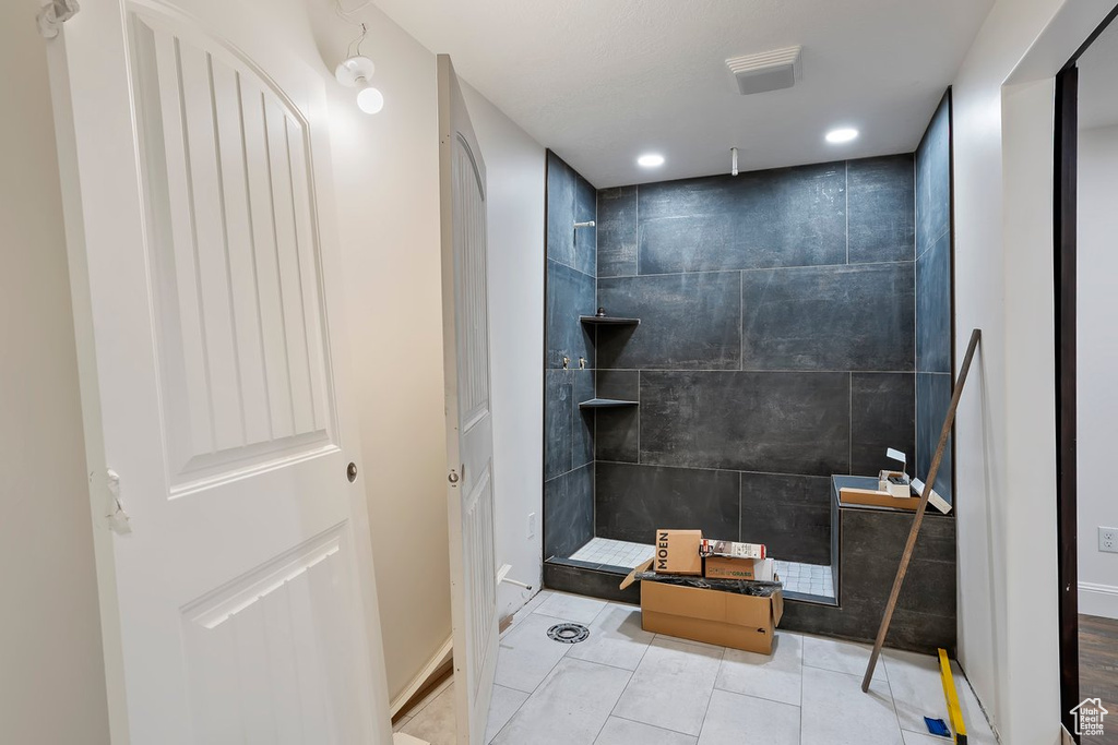 Full bath with walk in shower, recessed lighting, and tile patterned flooring