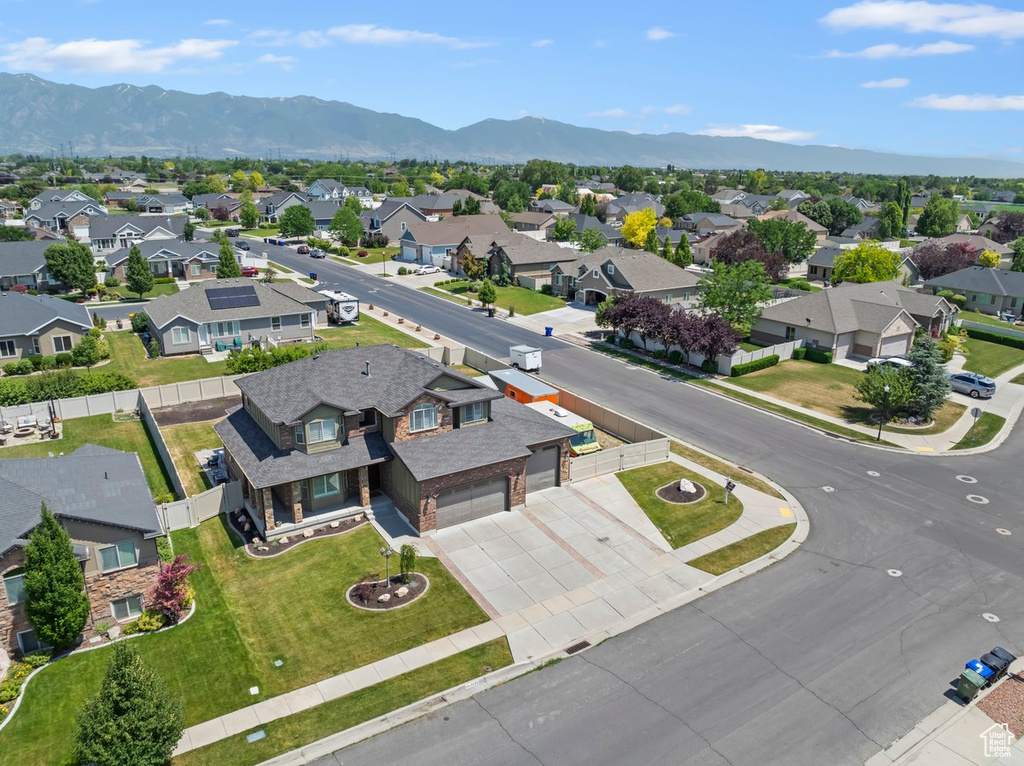 Aerial perspective of suburban area with a mountain backdrop