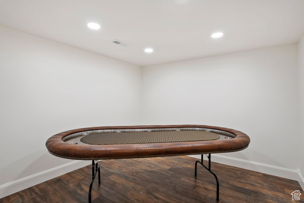 Misc room with wood finished floors and recessed lighting