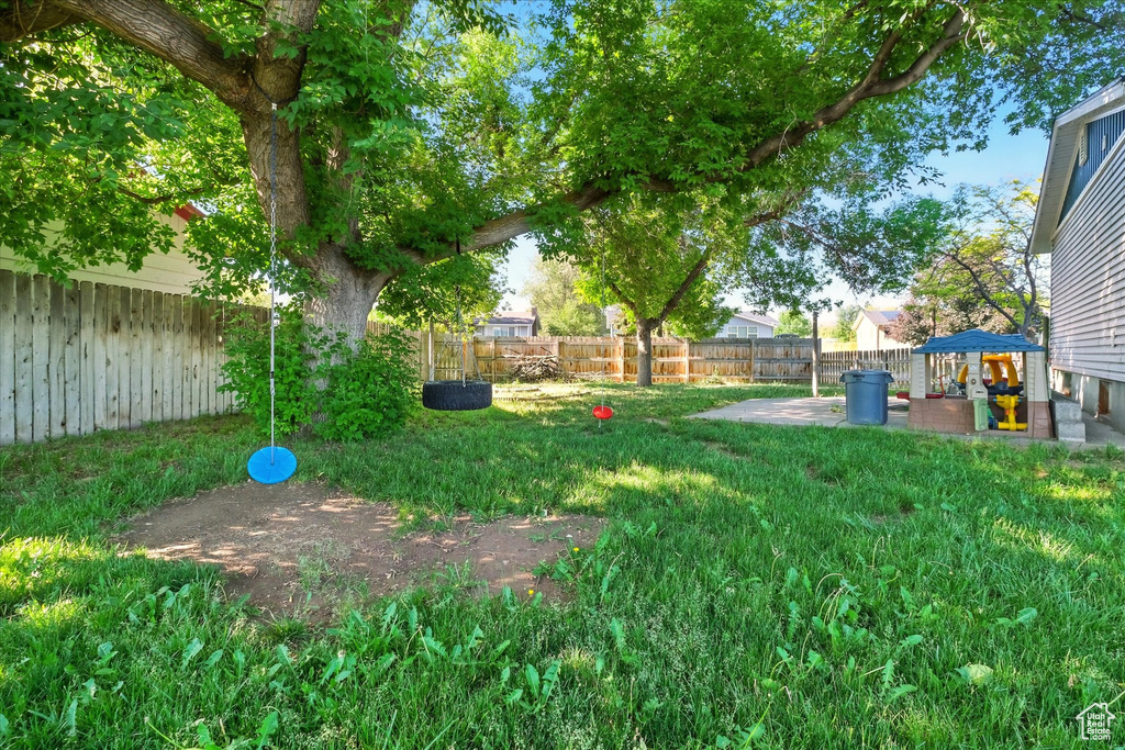 Fenced backyard featuring a patio area