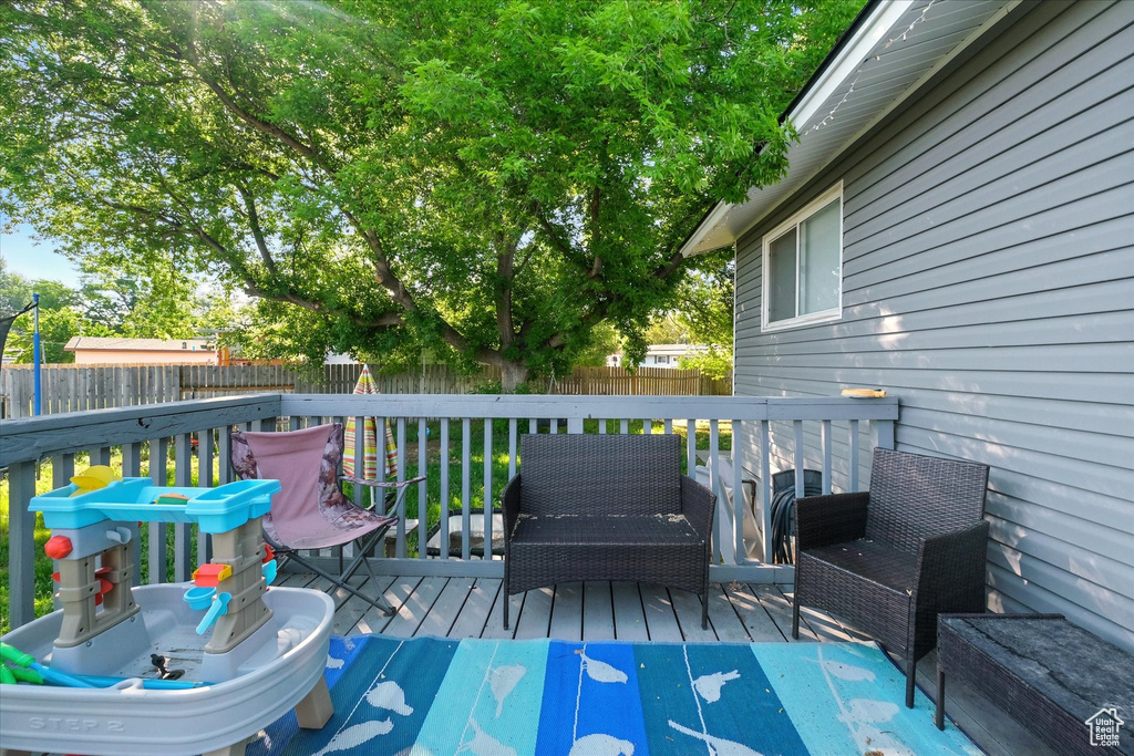 Deck with a fenced backyard