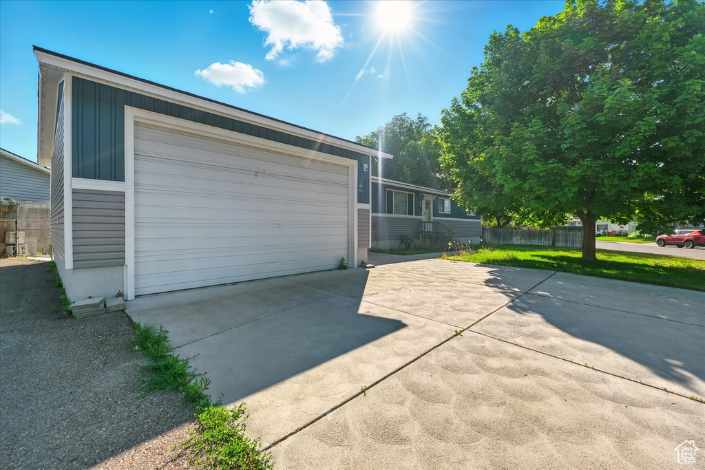 Garage with concrete driveway