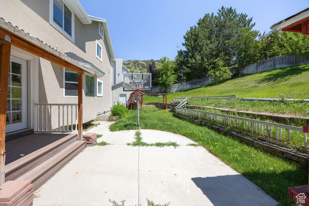 Fenced backyard with a patio area