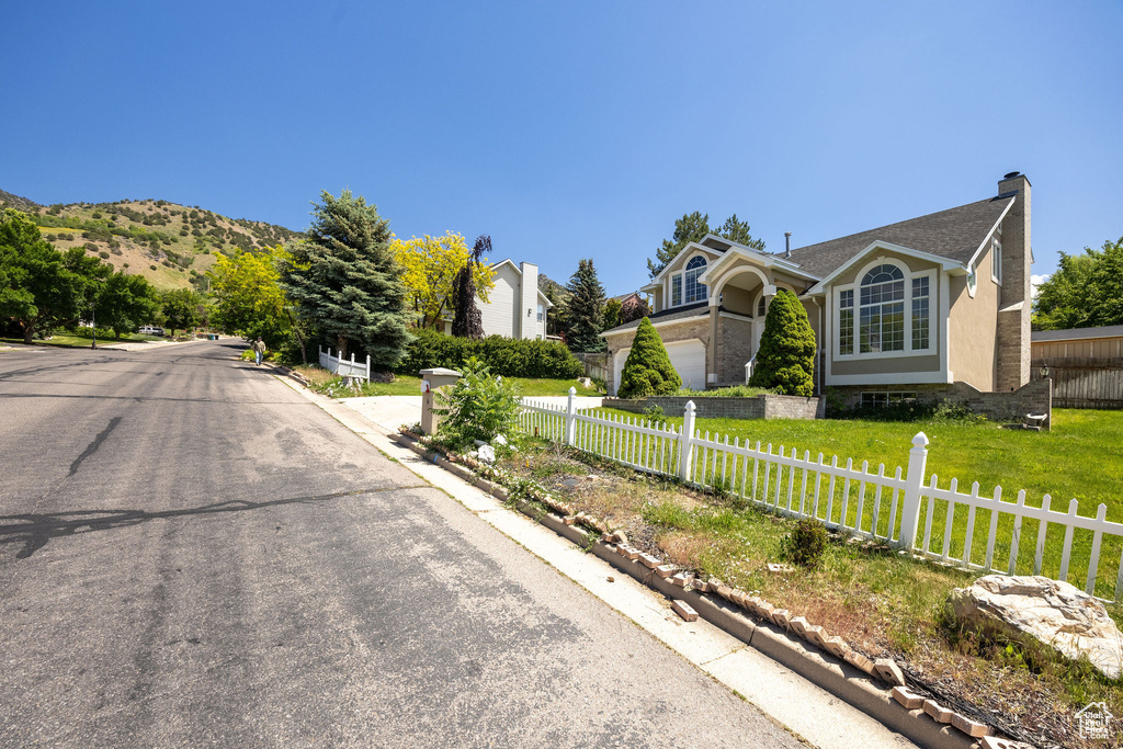 View of asphalt street with curbs