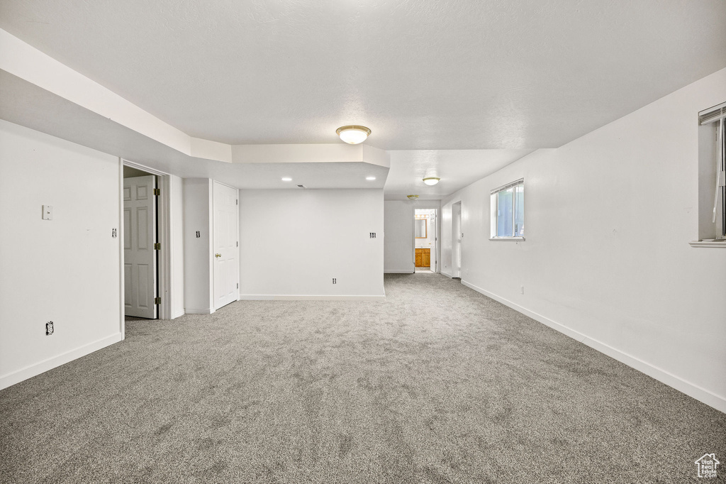 Spare room featuring carpet flooring and recessed lighting