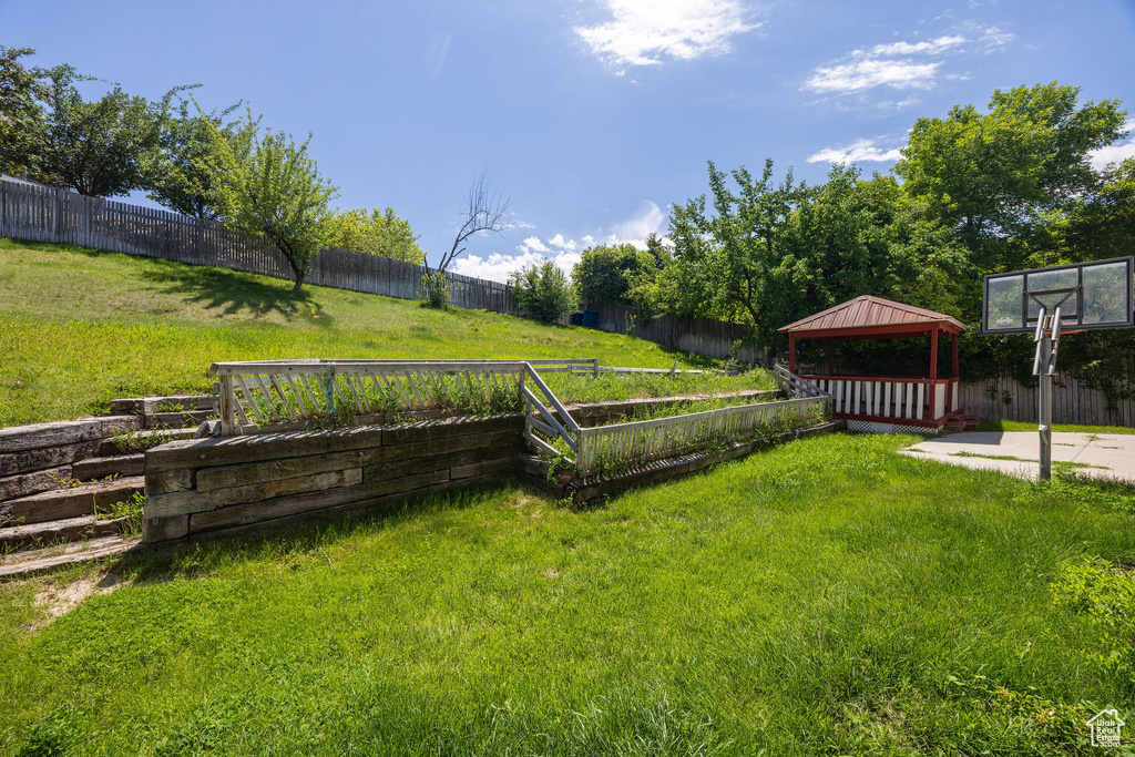 Fenced backyard with a gazebo