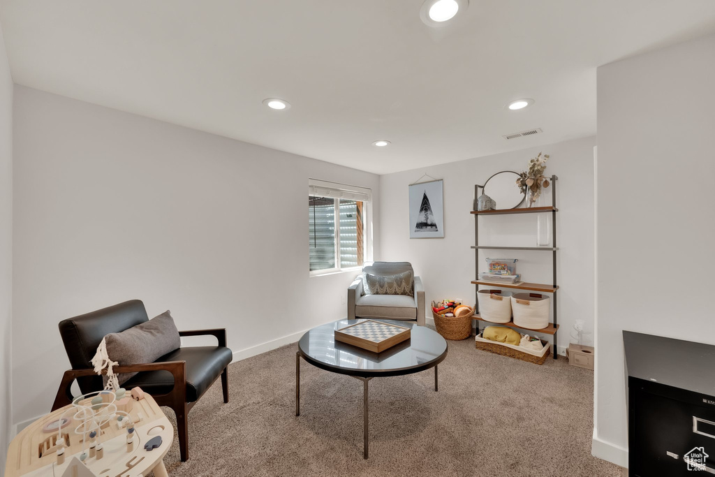 Living area featuring carpet floors, recessed lighting, and baseboards