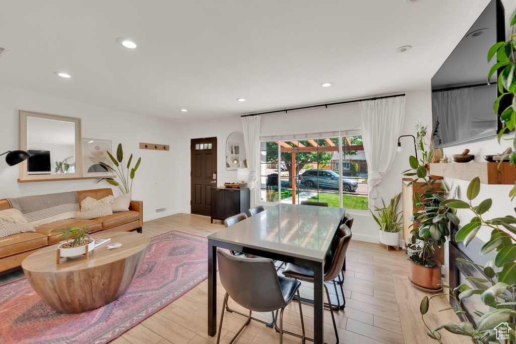 Dining room featuring recessed lighting, light wood-type flooring, and baseboards