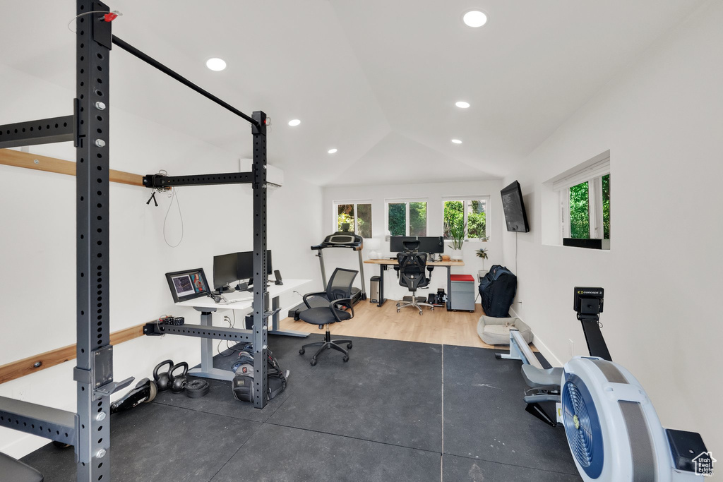 Workout room featuring recessed lighting, lofted ceiling, and baseboards