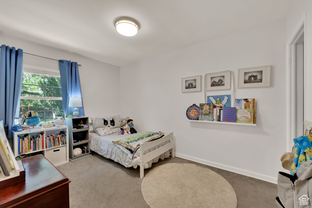 Carpeted bedroom with baseboards