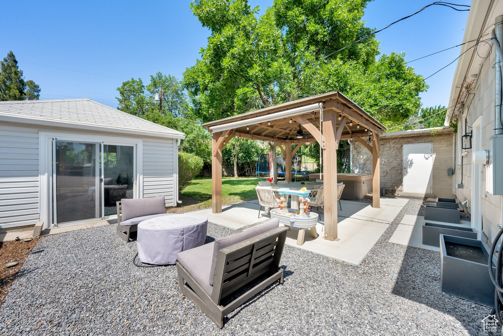 View of patio / terrace featuring a gazebo and an outbuilding