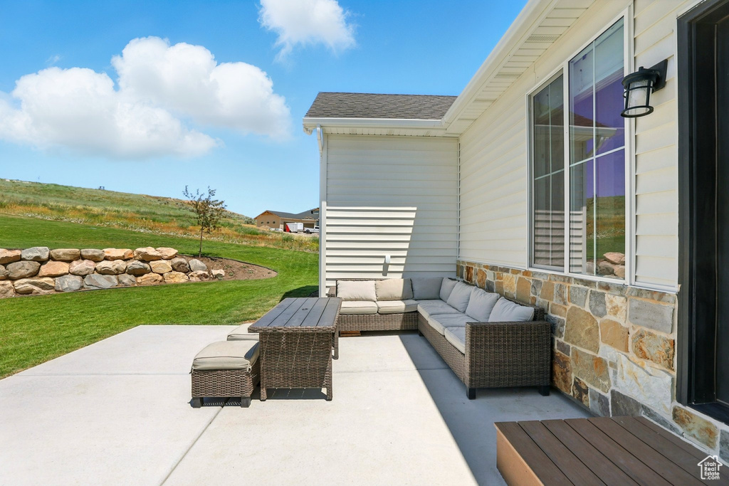 View of patio featuring an outdoor hangout area