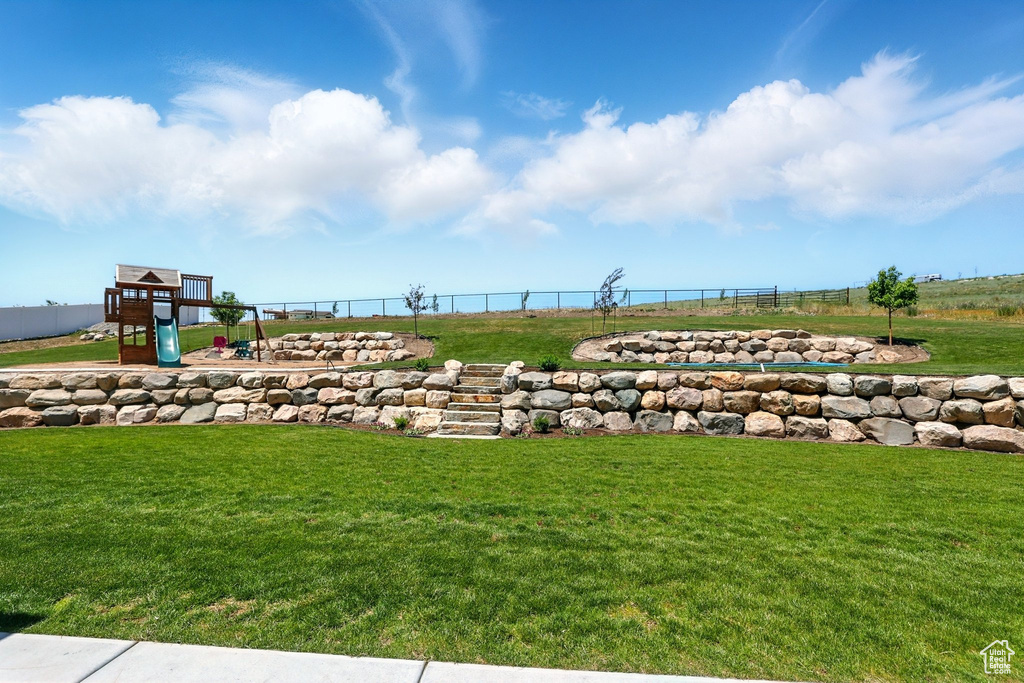View of yard with a playground