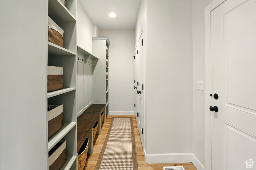 Mudroom with light wood-style floors and recessed lighting