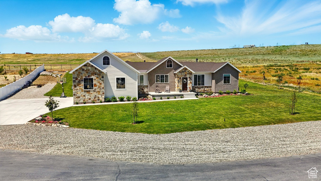 View of front of house with stone siding