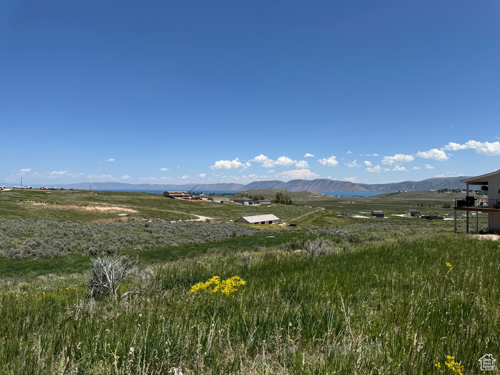 View of mountain backdrop with rural landscape