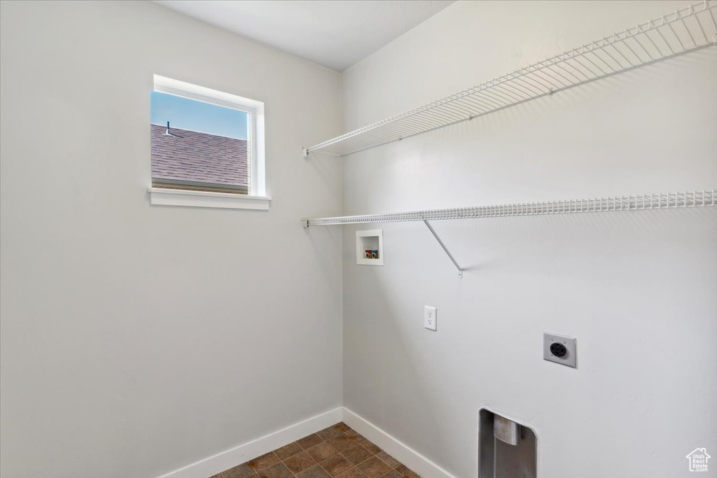 Laundry room featuring hookup for an electric dryer and hookup for a washing machine