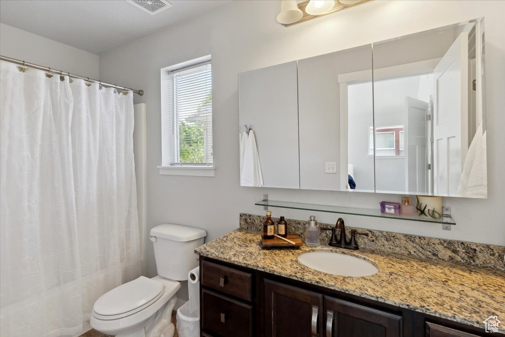 Bathroom with vanity and a shower with curtain
