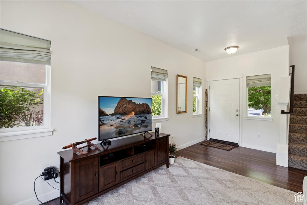 Foyer featuring light wood-style floors and plenty of natural light