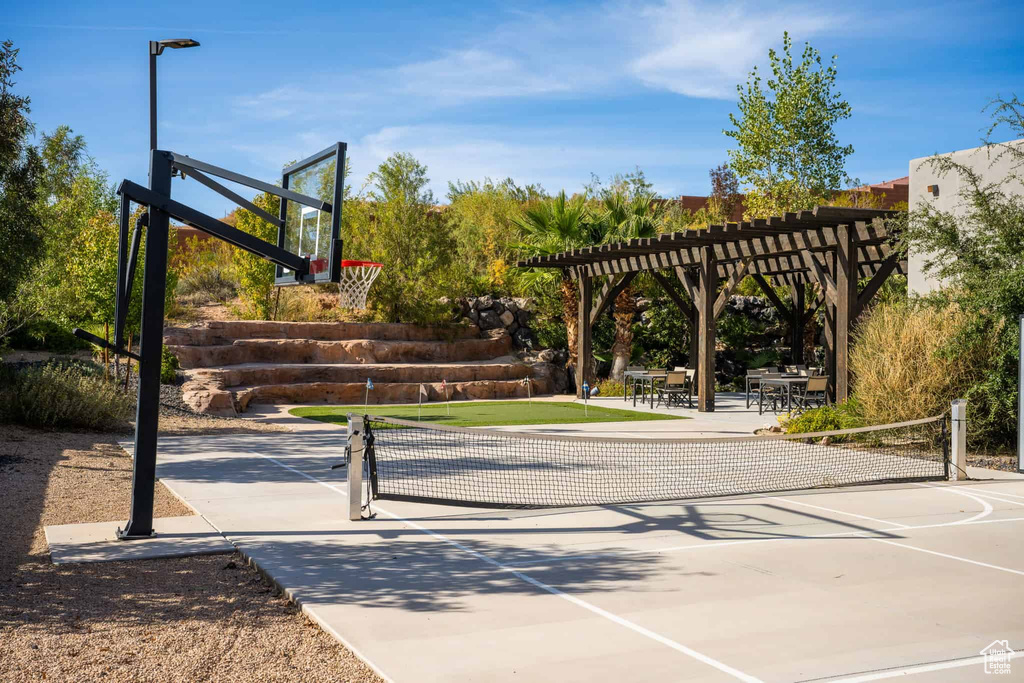 View of basketball court with a pergola